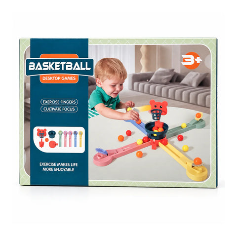 علبة Basketball Desktop Games عليها طفل بينطر الكور ناحية سلة الدبدوب، ومكتوب عليها 3+
