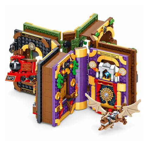 The four Magic Academy book-shaped building sets opened and joined at their spines, with the red train, the purple divination room and a flying dragon